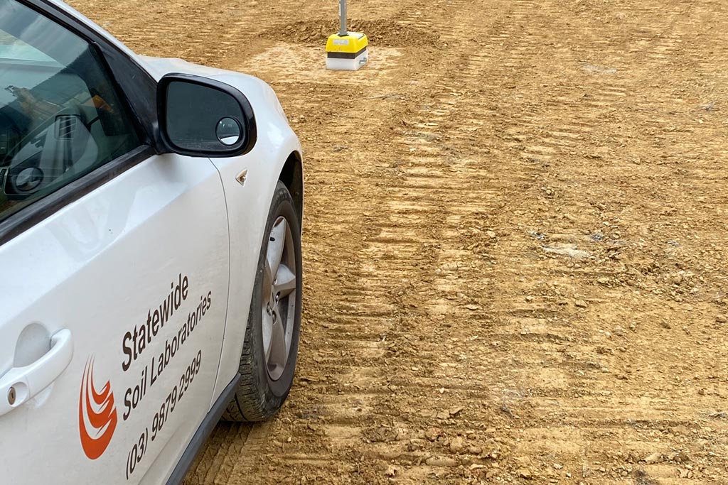 Technician performing earthwork testing